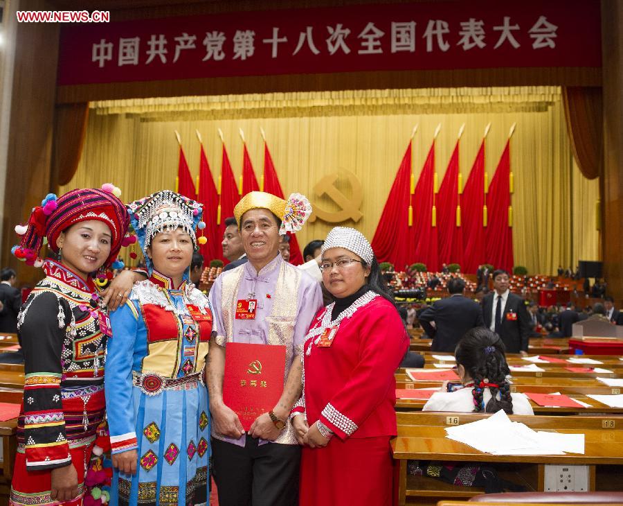 Delegates pose for a group photo after the closing session of the 18th National Congress of the Communist Party of China (CPC) at the Great Hall of the People in Beijing, capital of China, Nov. 14, 2012.