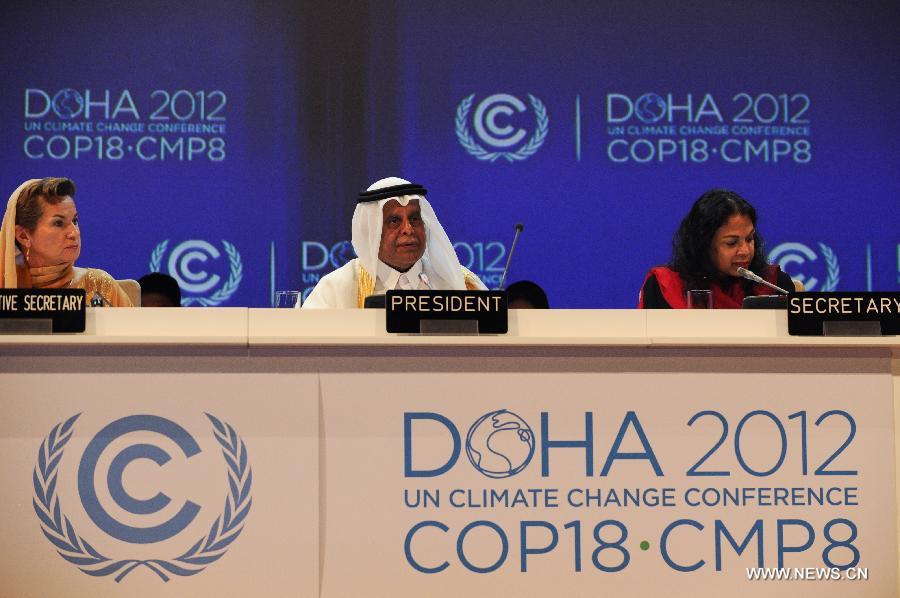 Abdullah bin Hamad Al-Attiyah (C), president of the 18th Conference of the Parties (COP18) to the United Nations Framework Convention on Climate Change (UNFCCC), and UNFCCC Executive Secretary Christiana Figueres (L) attends the opening ceremony of the UN climate change conference in Doha, capital of Qatar, on Nov. 26, 2012.