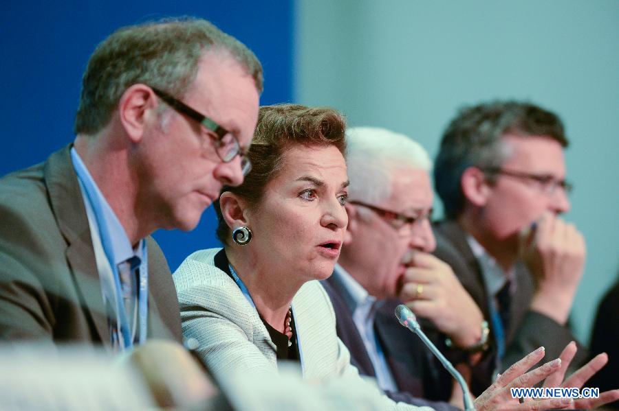 Christiana Figueres (2nd L), Executive Secretary of the United Nations Framework Convention on Climate Change (UNFCCC), speaks during a joint news conference on Fast Start Finance (FSF) on the second day of the 18th United Nations Convention on Climate Change in Doha, Nov. 27, 2012. 