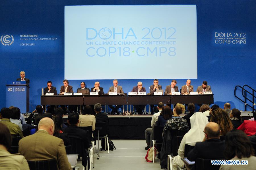 Delegates of EU and developed countries are seen on stage at a joint news conference on Fast Start Finance (FSF) on the second day of the 18th United Nations Convention on Climate Change in Doha, Nov. 27, 2012. 