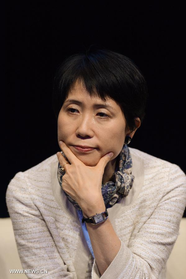 Naoko Ishii, Chief Executive Officer and Chair of the Global Environment Facility (GEF), gestures during the launch event for 'Momentum for Change: Innovative Financing for Climate-friendly Investment' at the Qatar National Conference Center (QNCC) on the penultimate day of the climate talks in Doha, Qatar, Dec. 6, 2012.