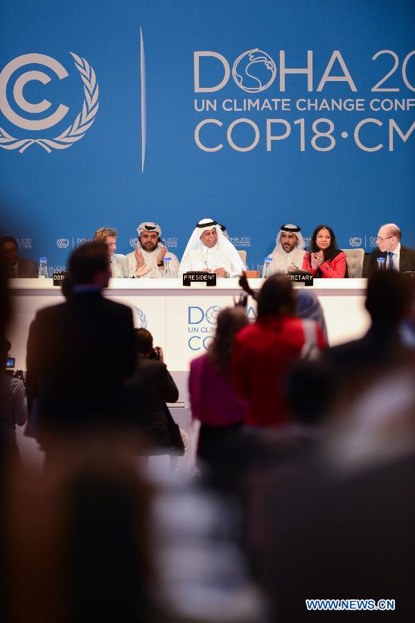 H.E. Abdullah Bin Hamad Al Attiyah (C), President for COP 18 and CMP 8 announces the final agreements of the UN Climate Change Conference (COP 18/CMP 8) at the Qatar National Convention Center (QNCC) in Doha, Qatar, Dec. 8, 2012.