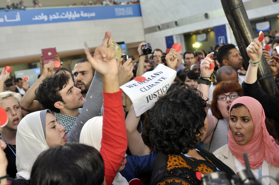 Over a hundred campaigners from non-governmental organizations gathered in outrage under the spider sculpture at Qatar National Convention Centre on December 7, calling for justice, ambition and finance in support of developing countries as two weeks of climate talks may produce the text that fails the planet. 