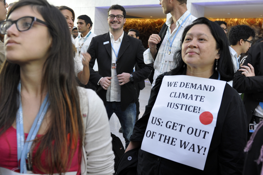 Over a hundred campaigners from non-governmental organizations gathered in outrage under the spider sculpture at Qatar National Convention Centre on December 7, calling for justice, ambition and finance in support of developing countries as two weeks of climate talks may produce the text that fails the planet. 