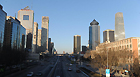 Vehicles move on the Jianguo Road in Beijing, capital of China, Feb. 1, 2013. A strong wind hit Beijing on Friday, blowing away the smog that lingered in the city for days.