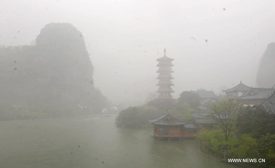 Photo taken on March 17, 2013 shows the fog scene of the Mulong Lake in Guilin, southwest China's Guangxi Zhuang Autonomous Region. 