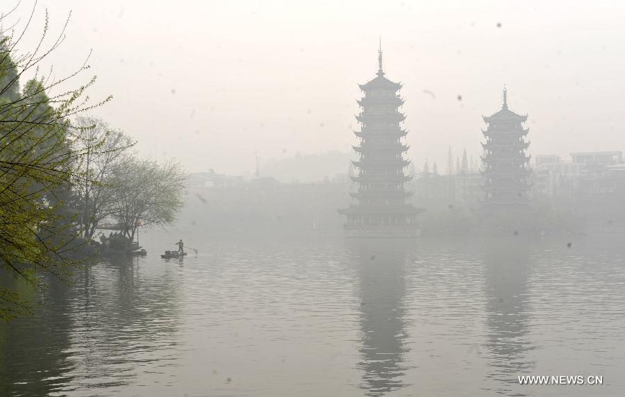 Photo taken on March 17, 2013 shows the fog scene of the Shanhu Lake in Guilin, southwest China's Guangxi Zhuang Autonomous Region. 