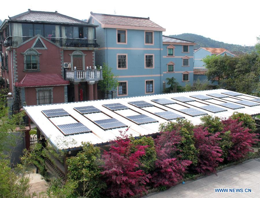 Photo taken on April 8, 2013 shows a homemade photovoltaic power station made by a local resident named Mo Zhikai in Wumeng Village of Ningbo City, east China's Zhejiang Province. 