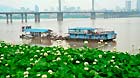 Photo taken on May 2, 2013 shows high water level under the Yinpenling Bridge on the Xiangjiang River in Changsha, capital of central China's Hunan Province.