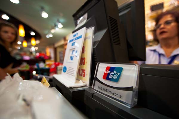 A shop in the Niagara Falls area in Canada accepts UnionPay cards for payment. China is pushing for renminbi internalization and encourages wider use of the yuan in international trade and currency reserves.