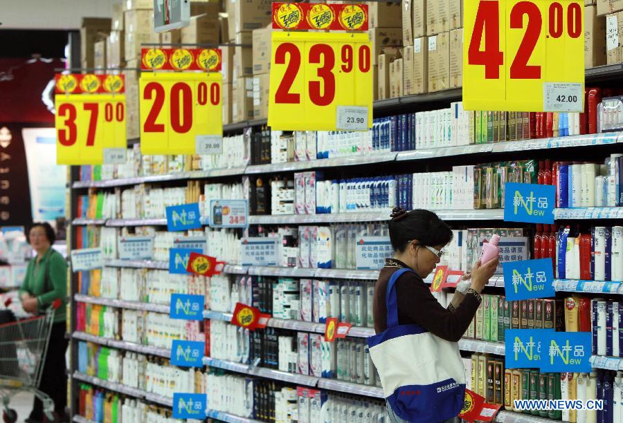 A consumer selects commodities at a supermarket in Shanghai, east China, May 9, 2013.