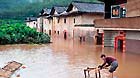 A villager cleans furniture in Baokeng Village of Meixian County in south China's Guangdong Province, May 19, 2013.