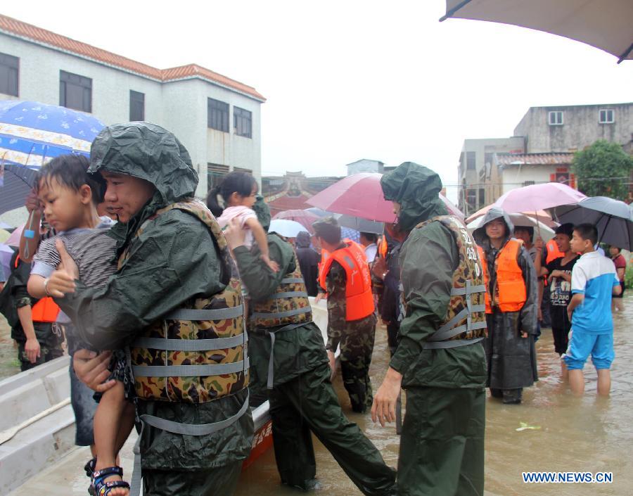 Rescuers evacuate children to lifeboats in Yanshi Village of Shanwei City, south China's Guangdong Province, May 22, 2013. Rescuers evacuate children to lifeboats in Yanshi Village of Shanwei City, south China's Guangdong Province, May 22, 2013.