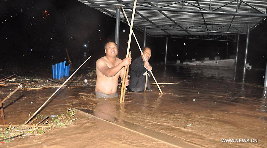 Villagers are trapped in the rain-triggered flood in Changba Village of Bijie City, southwest China's Guizhou Province, May 29, 2013. 