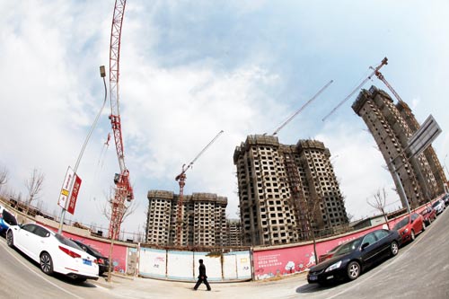 Buildings in Beijing being constructed by Poly Group. The group entered the real estate industry in 1992, and the revenue of its real estate unit accounted for nearly 90 percent of the group's 98 billion yuan in revenue last year.