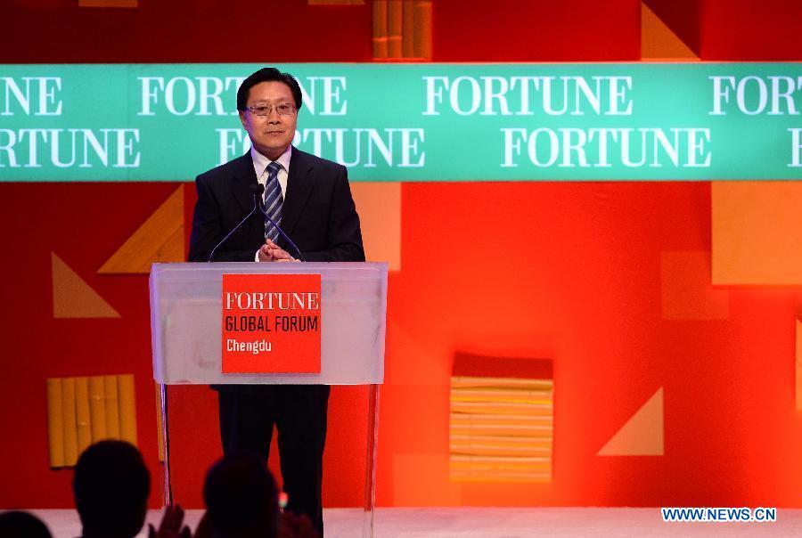 Wang Dongming, Secretary of the Sichuan Provincial Committee of the Communist Party of China, attends the opening ceremony of the 2013 Fortune Global Forum in Chengdu, capital of southwest China's Sichuan Province, June 6, 2013.