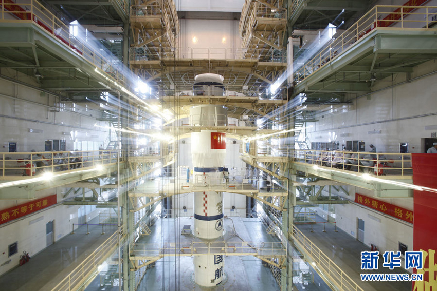 The Shenzhou 10 spacecraft, atop its Long March-2F carrier rocket booster, has been vertically transferred from a preparation area to the launch pad at the Jiuquan Satellite Launch Center in the Gobi desert. The Shenzhou 10 spacecraft, atop its Long March-2F carrier rocket booster, has been vertically transferred from a preparation area to the launch pad at the Jiuquan Satellite Launch Center in the Gobi desert.