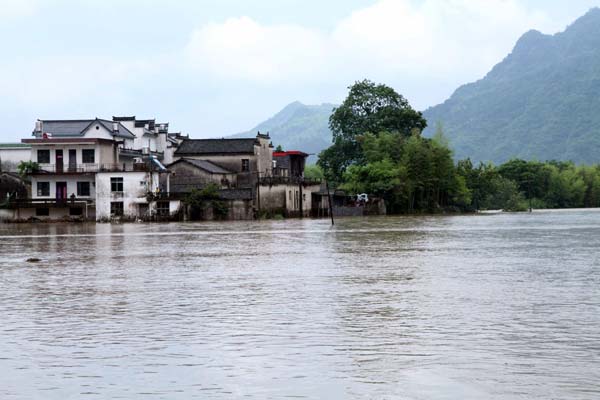 Dongting village is trapped by flood in Xiuning County, Anhui Province on June 7, 2013.