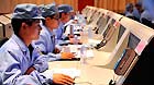 Technicians trace and monitor Shenzhou-10 spacecraft at a control central located in Taiyuan, north China's Shanxi Province, June 11, 2013.
