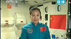 This TV grab taken on June 20, 2013 shows female astronaut Wang Yaping (R), one of the three crew members of Shenzhou-10 spacecraft, giving a lecture to students on Earth aboard China's space module Tiangong-1.