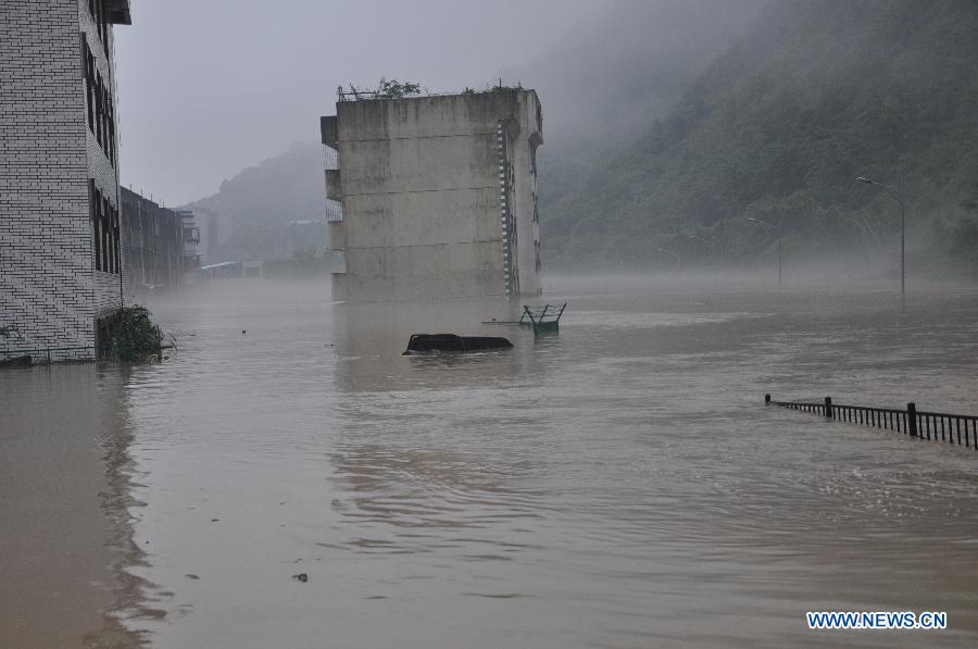 A building is flooded in rainstorm-hit Beichuan Qiang Autonomous County, southwest China's Sichuan Province, July 9, 2013. 
