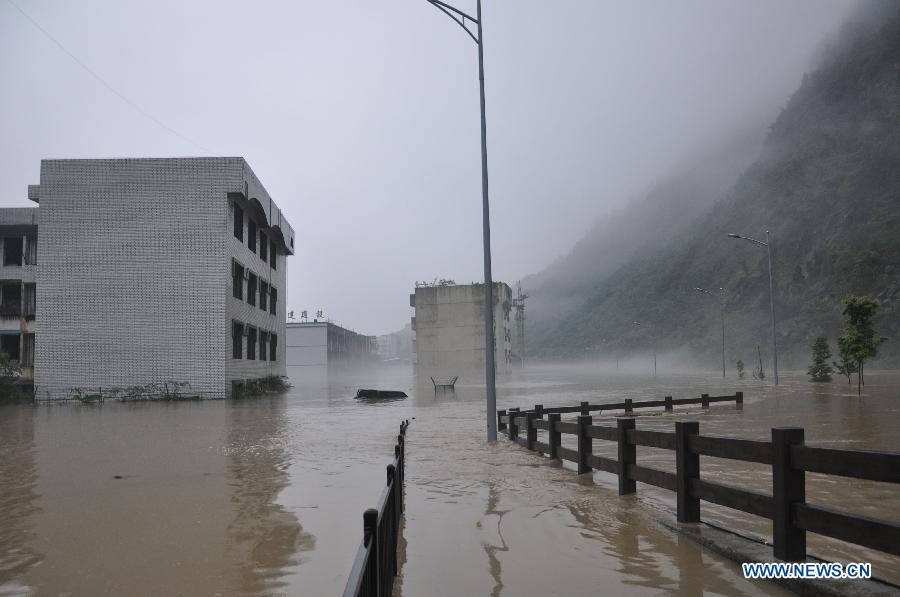 Buildings are flooded in rainstorm-hit Beichuan Qiang Autonomous County, southwest China's Sichuan Province, July 9, 2013. 