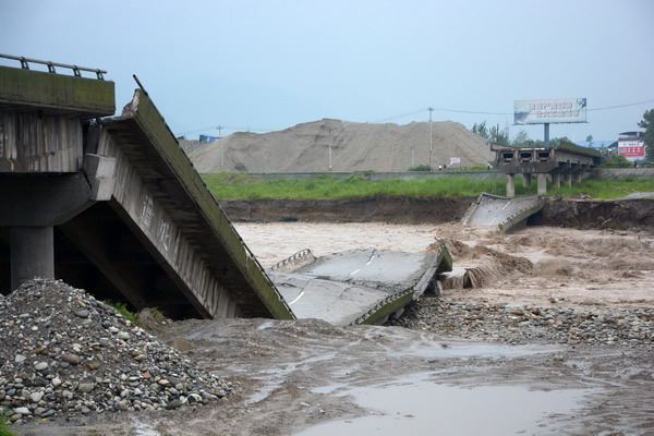 A bridge collapses due to rainstorms in Deyang City, southwest China's Sichuan Province, July 9.