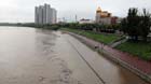 The water level of the Songhua River rises in Jilin City, northeast China's Jilin Province, Aug. 8, 2013. Jilin City has suffered continuous rainfall since Wednesday night, which caused the water level of the Songhua River rises to 188.67 meters in the city. Yellow alert on thunder and blue alert on torrential rain have been released by Jilin provincial meteorological observatory.