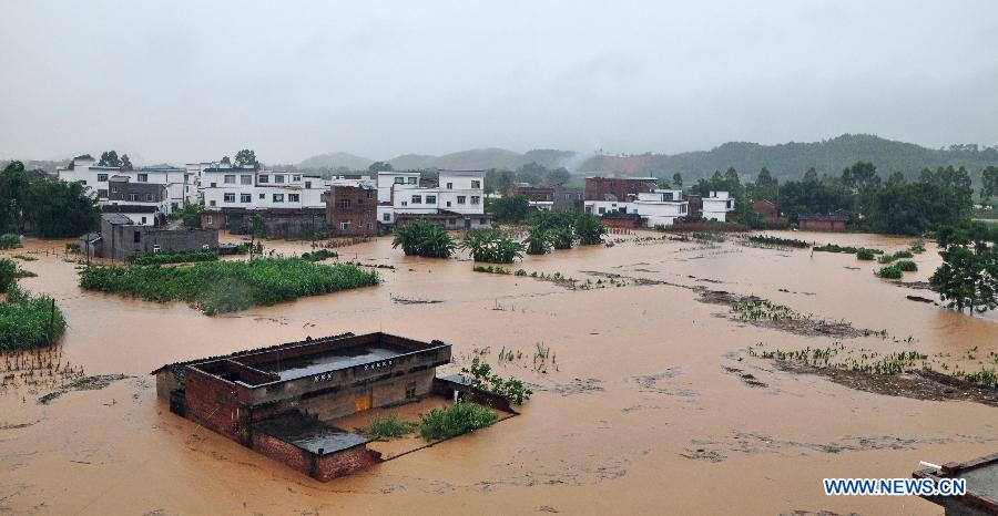 Photo taken on Aug. 19, 2013 shows the flooded Caichang Village in Xiangzhou County of Laibin City, south China&apos;s Guangxi Zhuang Autonomous Region.