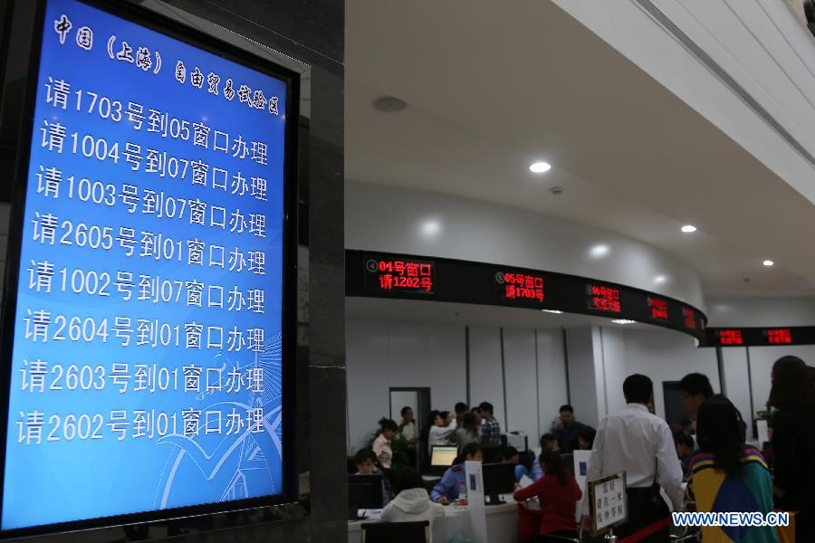 An LCD panel is seen in the service hall of the free trade zone (FTZ), east China&apos;s Shanghai, Oct. 8, 2013.