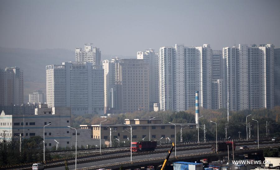 Xining, capital of northwest China&apos;s Qinghai Province is shrouded in haze, Oct. 9, 2013.