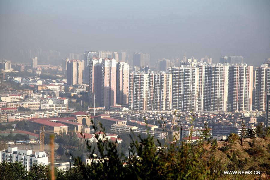 Xining, capital of northwest China&apos;s Qinghai Province is shrouded in haze, Oct. 9, 2013. 