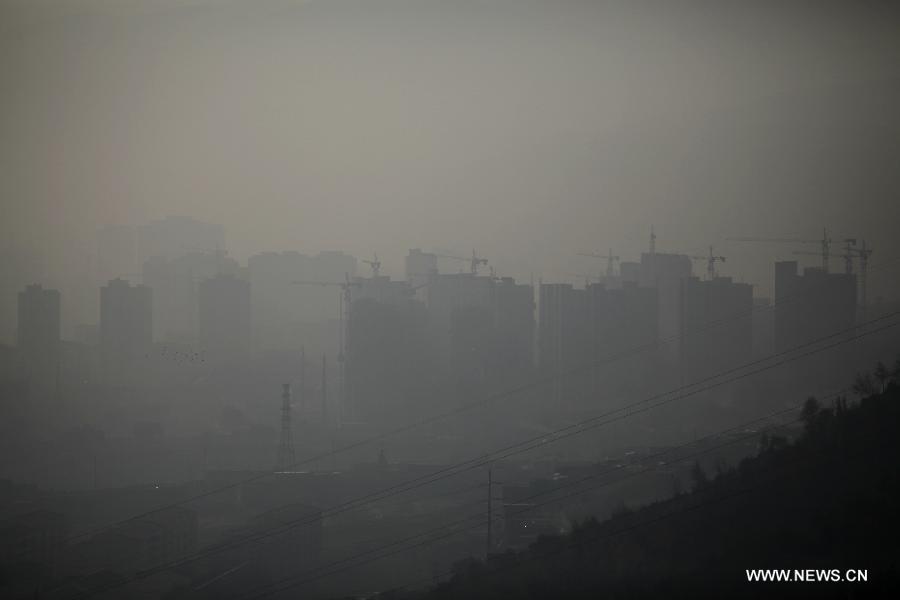 Xining, capital of northwest China&apos;s Qinghai Province is shrouded in haze, Oct. 9, 2013.