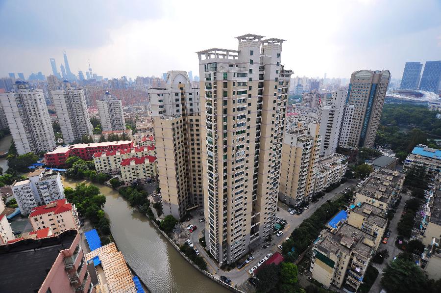 Residential buildings are seen in Hongkou District, east China&apos;s Shanghai, Oct. 22, 2013. 