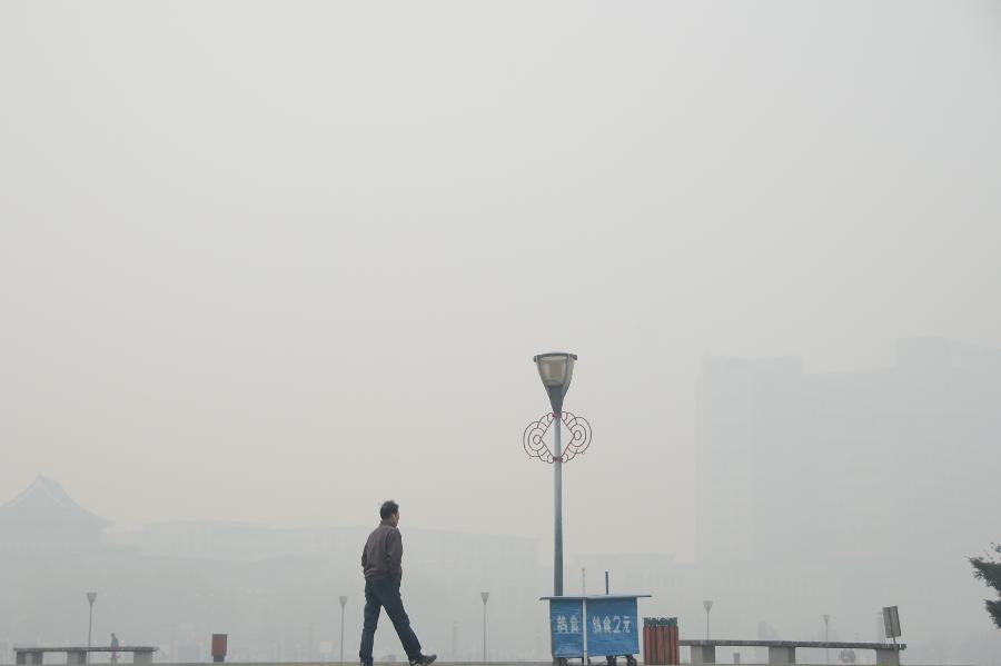 A man walks on square in downtown Changchun, capital of northeast China&apos;s Jilin Province, Oct. 23, 2013. 