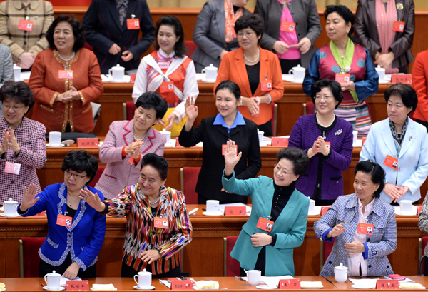 Delegates from around China attend the opening ceremony of the 11th National Women's Congress in Beijing on Monday. The congress is expected to draw up a blueprint for the economic advancement of Chinese women in the next five years. 