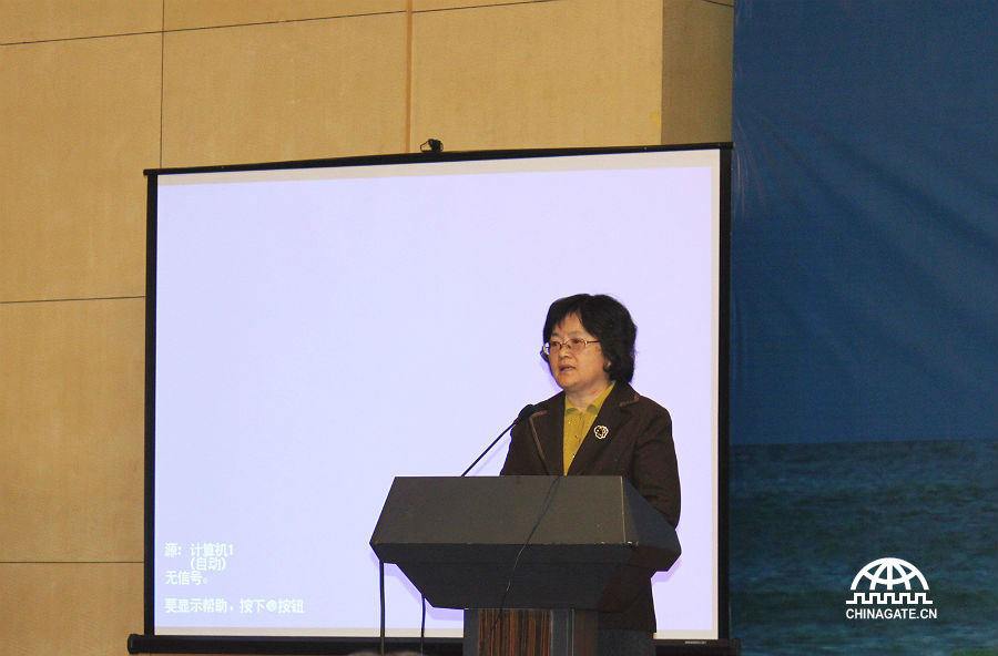 Zhang Chenghui, Director of the Research Institute of Finance, Development Center of the State Council delivers a speech at the conference on Oct. 31.