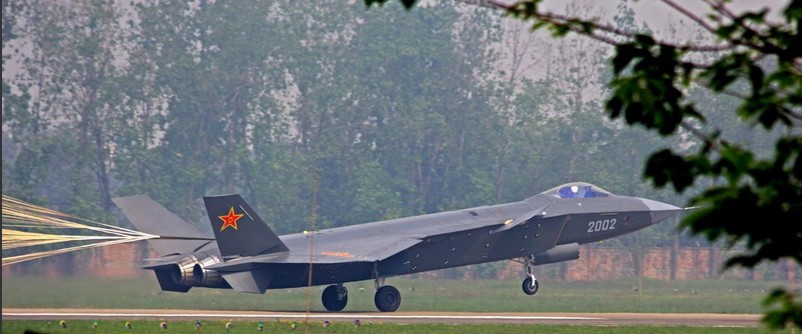 J-20 stealth fighter opens its drogue parachute for extra braking when landing. [Photo/Huanqiu]