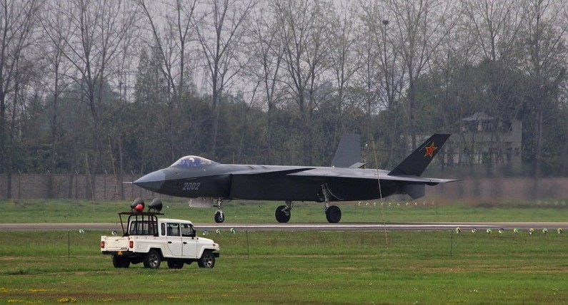 J-20 stealth fighter opens its drogue parachute for extra braking when landing. [Photo/Huanqiu]