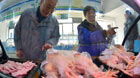 People shop chilled poultry at a market in Shanghai, east China, Jan. 28, 2014. Shanghai will halt live poultry trading from Jan. 31 to April 30 this year and strengthen surveillance of poultry and industry staff. So far, eight H7N9 cases have been reported in Shanghai, and four of those patients have died.