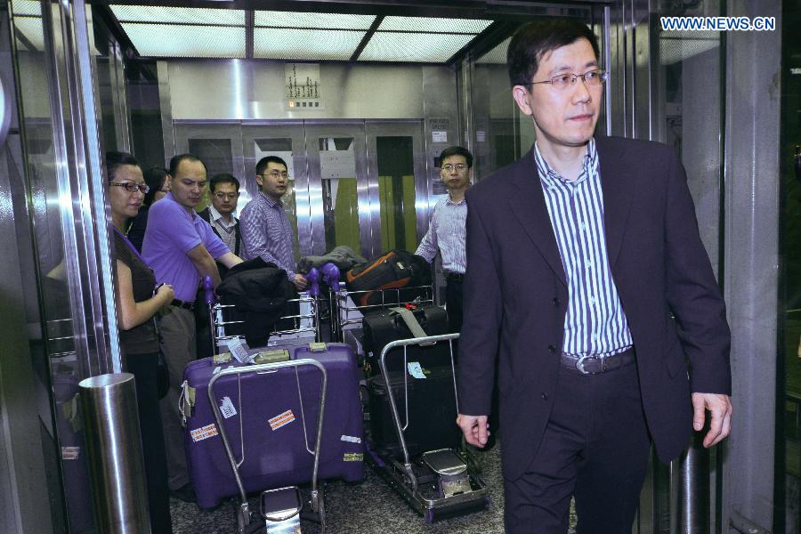 Guo Shaochun (C), head of a joint working group in charge of the missing Malaysia Airlines flight incident, receives interview at the International Airport of Kuala Lumpur in Sepang, Malaysia, on March 10, 2014. 