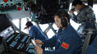 Crew members of Chinese Air Force search the sea areas where the missing Malaysia Airlines flight MH370 lost contact, Malaysia, March 12, 2014. Multinational search operation to locate missing Malaysia Airlines flight MH370 has been expanded to two areas with more countries joining in the mission