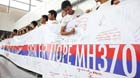 The photo taken on March 16, 2014 shows good wishes on a banner dedicated to the missing Malaysia Airlines flight MH370 at the international airport of Kuala Lumpur, Malaysia.