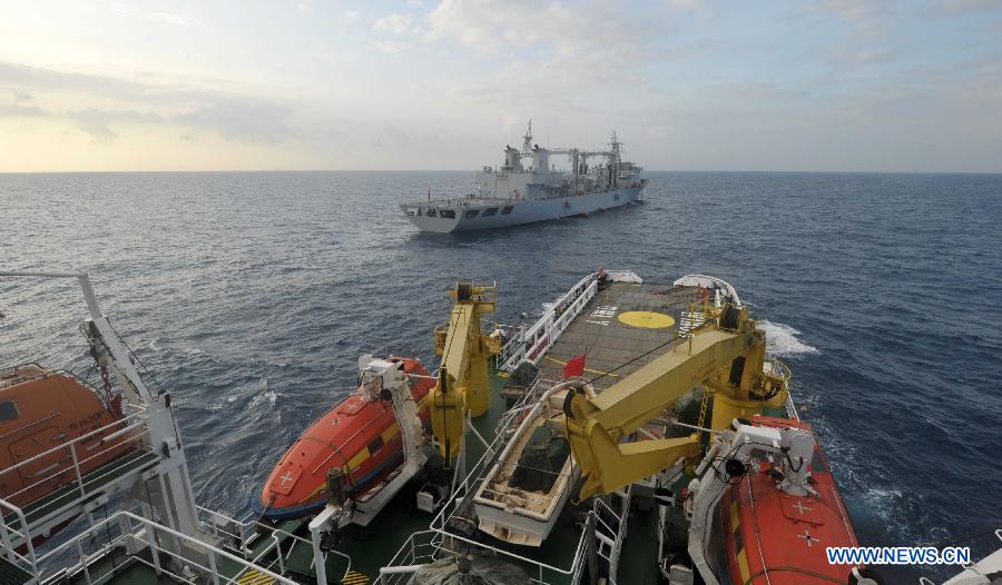 The Chinese rescue vessel 'Nanhaijiu 101' approaches Qiandaohu comprehensive supply ship (Rear), as both of them head toward Singapore to join in the search for missing Malaysia Airlines flight MH370, March 18, 2014. At 8:00 a.m. on Tuesday, China's Ministry of Transportation ordered all Chinese vessels in the Gulf of Thailand to leave for searches in the waters southeast of the Bay of Bengal and near the Sunda Strait.