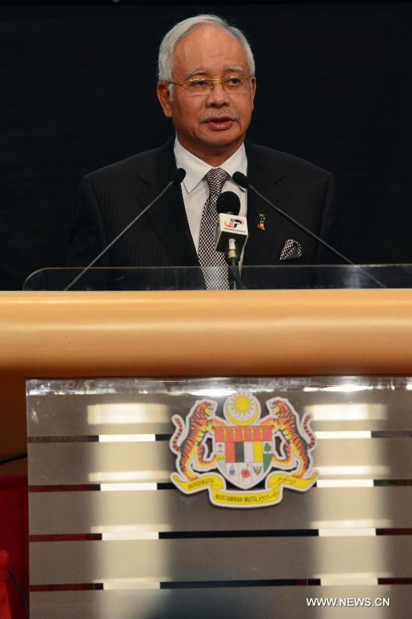 Malaysian Prime Minister Najib Razak speaks during a press conference in Kuala Lumpur, Malaysia, March 24, 2014. New analysis of statellite data suggested that the missing Malaysia Airlines Flight MH370 'ended' in the southern Indian Ocean, said Malaysian Prime Minister Najib Razak on Monday. 