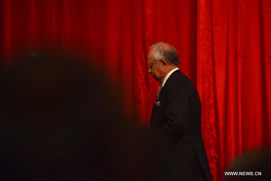 Malaysian Prime Minister Najib Razak speaks during a press conference in Kuala Lumpur, Malaysia, March 24, 2014. New analysis of statellite data suggested that the missing Malaysia Airlines Flight MH370 'ended' in the southern Indian Ocean, said Malaysian Prime Minister Najib Razak on Monday. 