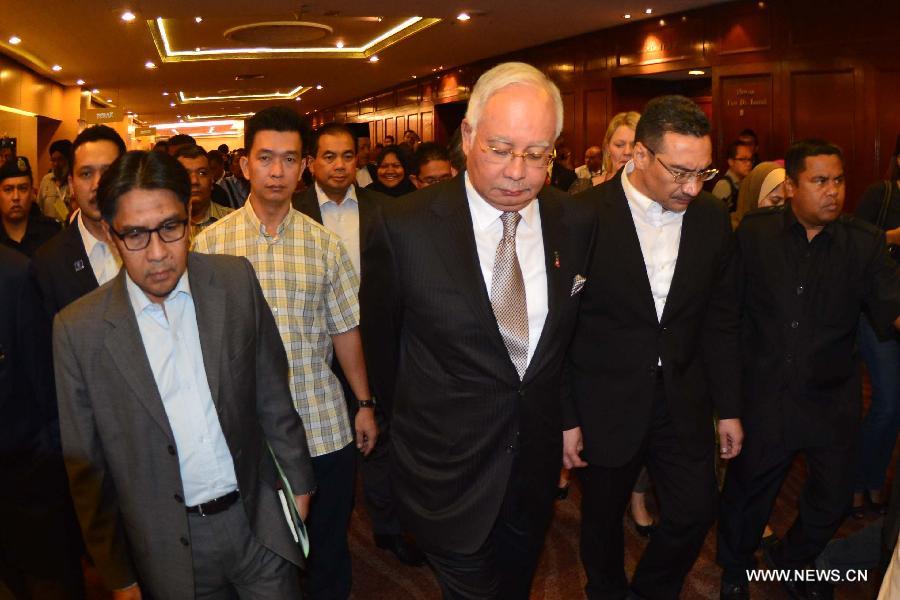 Malaysian Prime Minister Najib Razak speaks during a press conference in Kuala Lumpur, Malaysia, March 24, 2014. New analysis of statellite data suggested that the missing Malaysia Airlines Flight MH370 'ended' in the southern Indian Ocean, said Malaysian Prime Minister Najib Razak on Monday. 