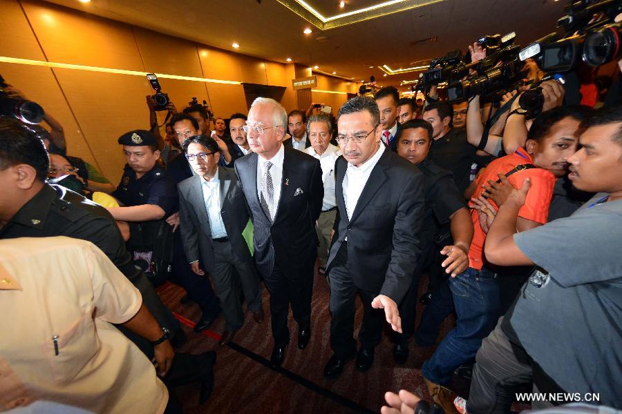 Malaysian Prime Minister Najib Razak speaks during a press conference in Kuala Lumpur, Malaysia, March 24, 2014. New analysis of statellite data suggested that the missing Malaysia Airlines Flight MH370 'ended' in the southern Indian Ocean, said Malaysian Prime Minister Najib Razak on Monday. 