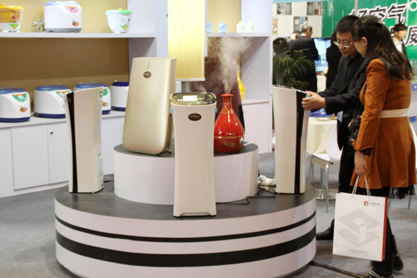 Air purifiers are shown at an international ecological technology and equipment expo in Beijing. GFK, a service provider of market research and consultancy, said that about 1.7 million air purifiers were sold in China in 2013, a 116 percent year-on-year increase.