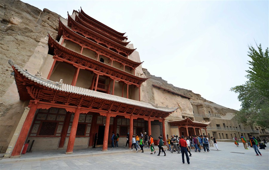A group of tourists visits the Mogao Grottoes in Dunhuang, Gansu Province, yesterday. — Xinhua 